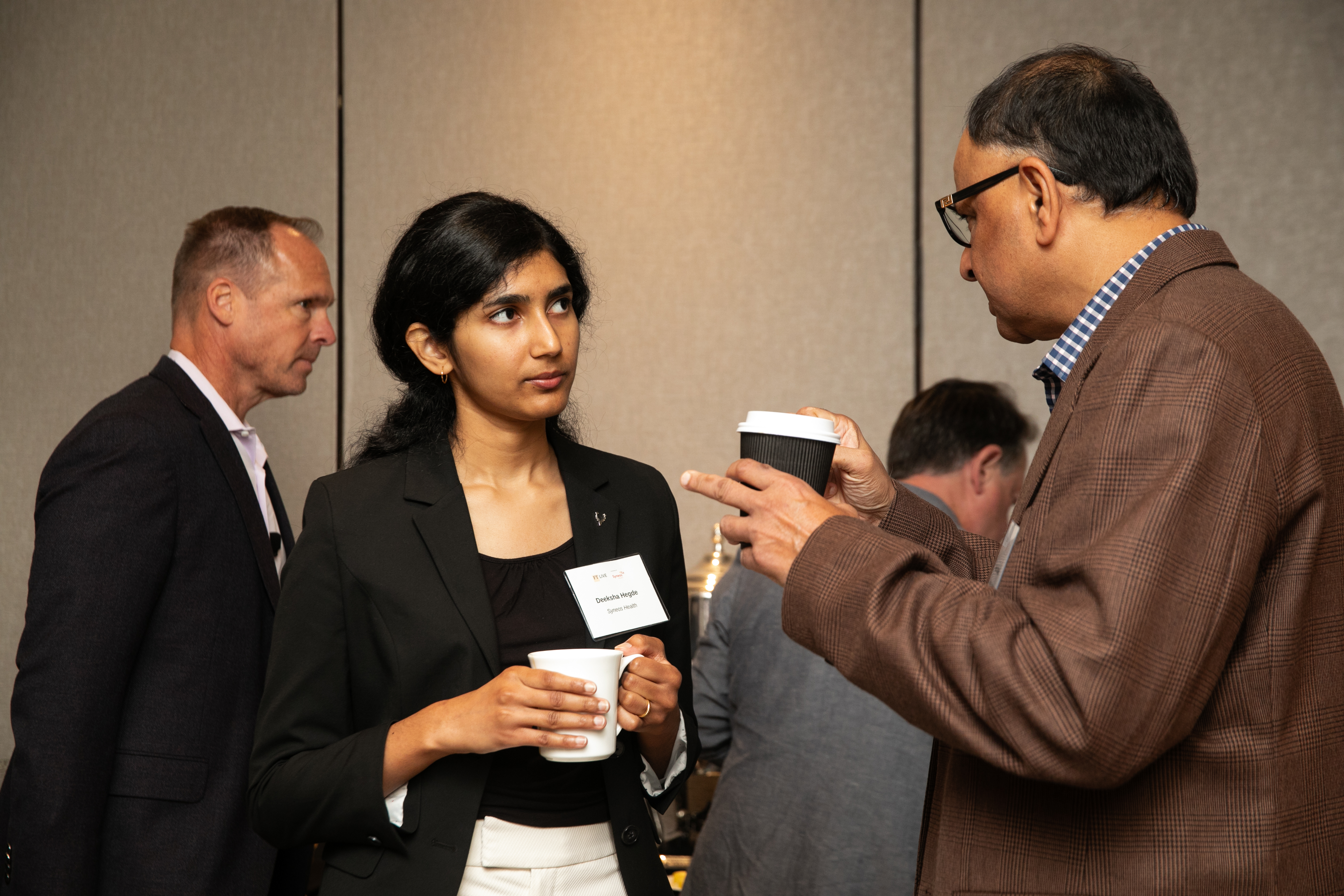 Deeksha Hegde networking at FT Live Financing Biotech Innovation event — Syneos Health